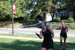 Juniors Caroline Kneeley and Elizabeth Gay sharpen up their saber skills. 