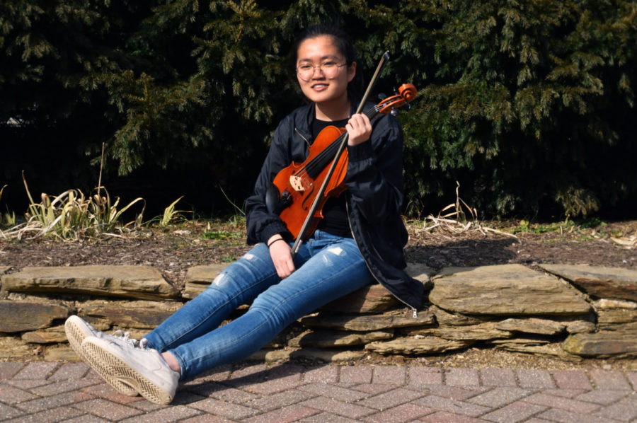 Practice makes perfect: Junior Nichole Lee sits with her viola. Spending three hours a day practicing, Lee has built a strong dedication to her music.