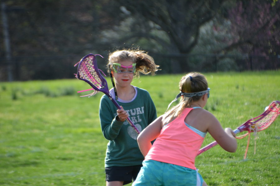 Varsity+lacrosse+girls+scoop+up+the+opportunity+to+help+younger+players