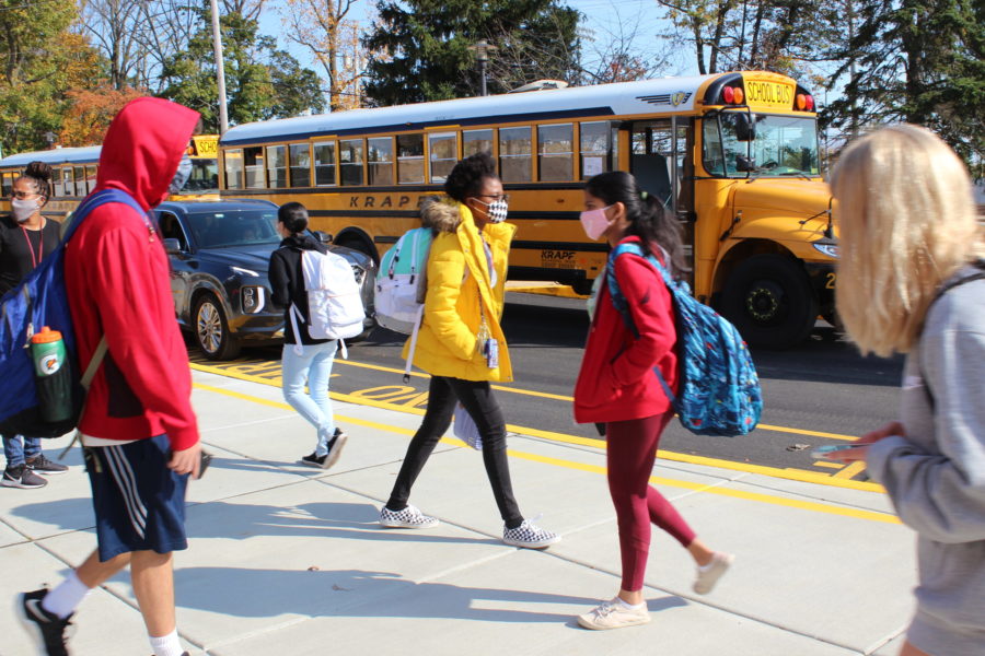 Students walk to their busses at the end of the school day. 