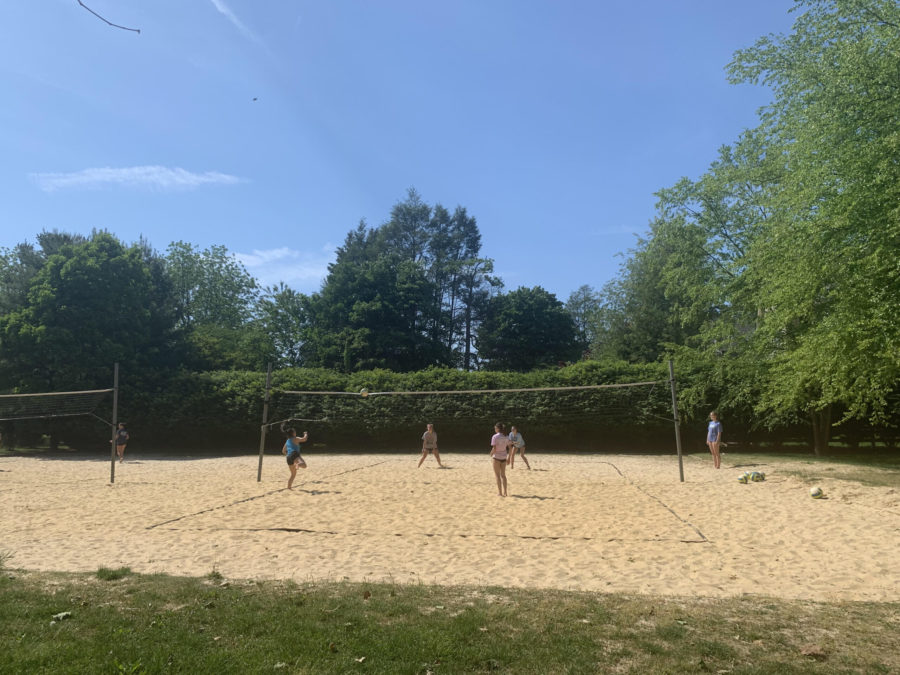 Fun in the sun: Members of the Sand Volleyball Club scrimmage against each other at Johnson Park on May 20th.