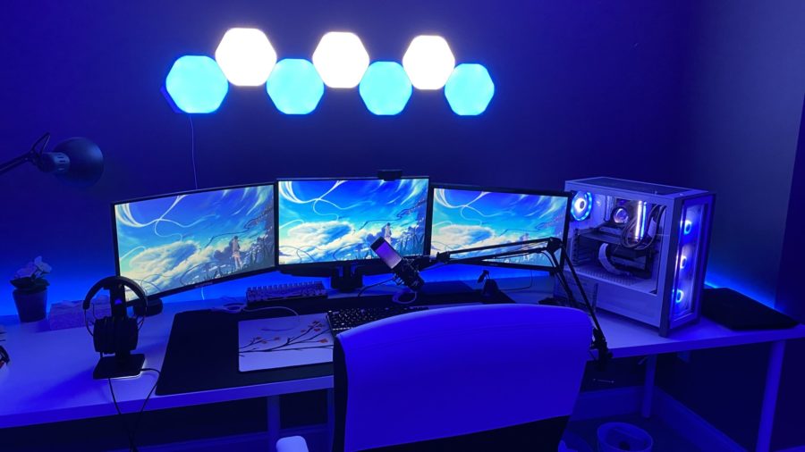 Gifted Gamer: Freshman Tony Xu sets up his computer and three moniters for a gaming session. Xu has played Fortnite for about 3 years now. He looks to continue growing his accounts and having fun creating content.