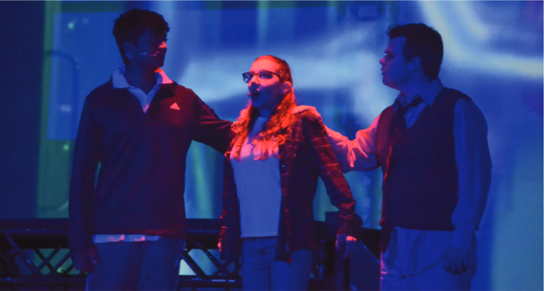 Sweet escape: Meg and her father, joined by Calvin, played by seniors Cate Oken and Scott Angelides and junior Akhilesh Baddi, respectively, narrowly escape Camazotz and the wrath of “It.” After the trio made it to safety, they planned their approach to destroying the darkness and saving Meg’s brother, Charles Wallace.