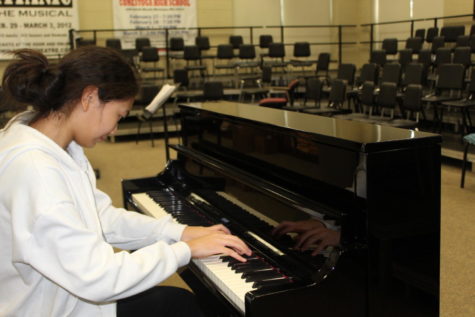 Deng started playing piano at 3 years old. She practices through her piece.