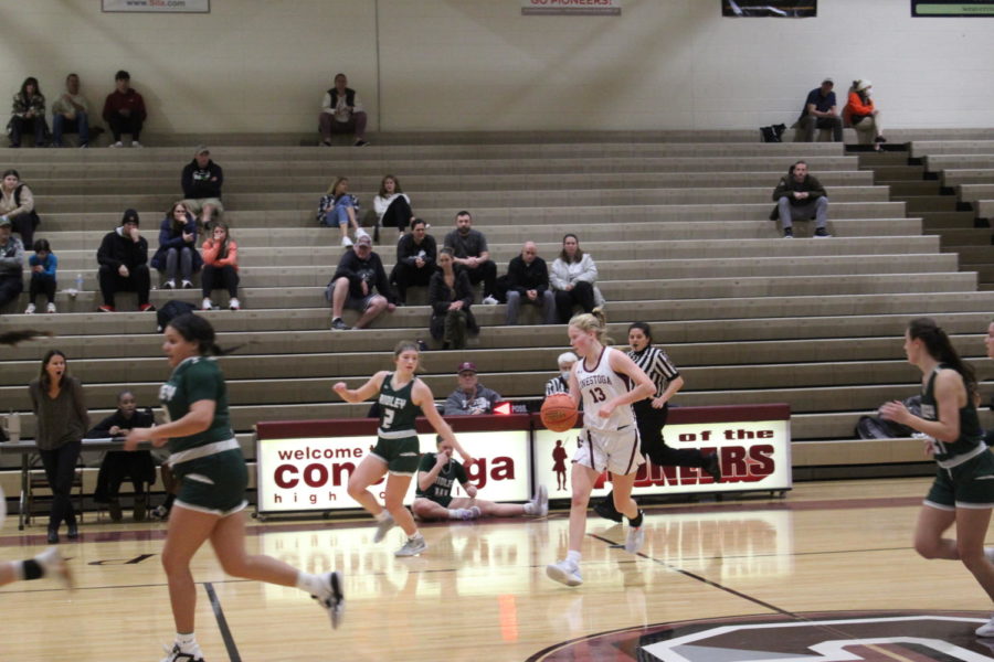 Rapid Rebound: Ryann Jennings plucks the ball out of the air and hustles to the center for one of her 8 rebounds. The 5’11” shooting guard has proven herself to be a vital asset to the team.