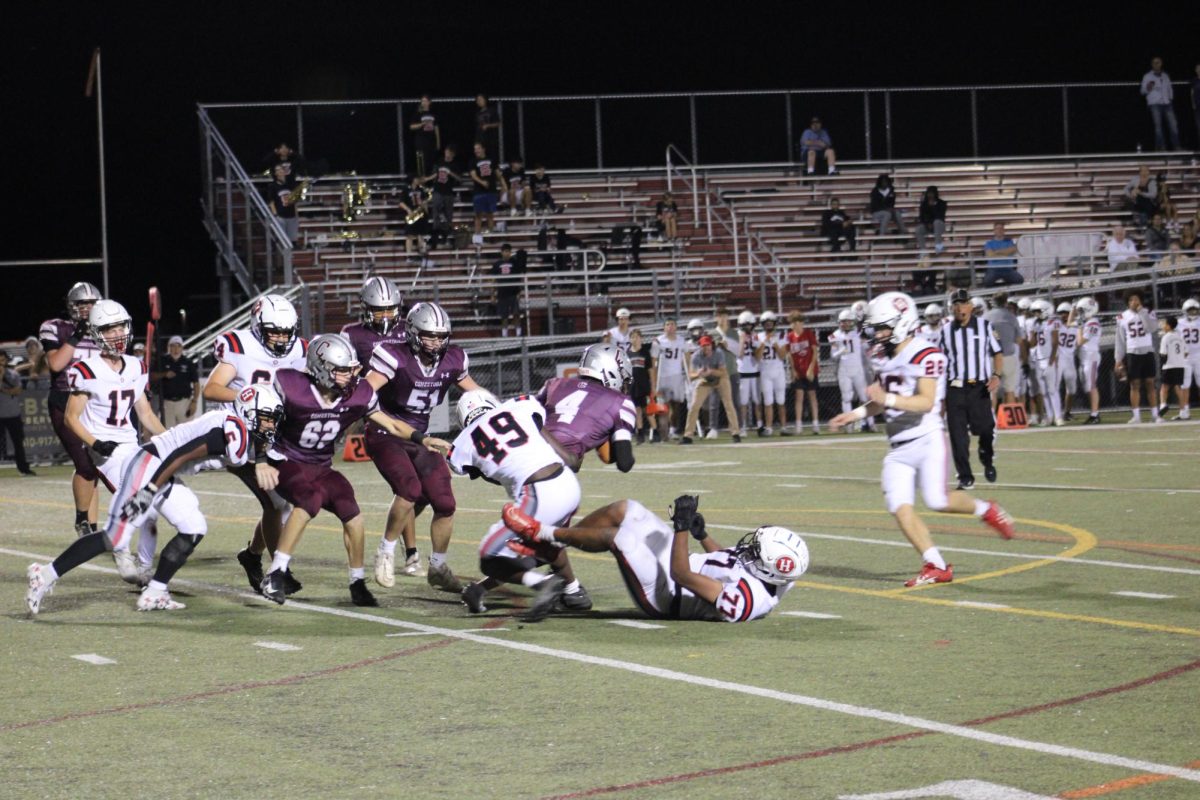 Football beats Harriton 35-6 for blackout homecoming game