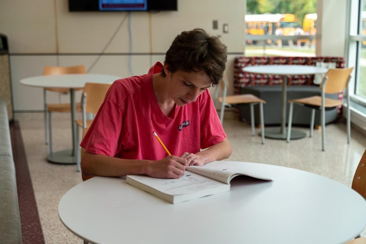 Learning language: Senior Rowan Bellew prepares for a Spanish 6 examination. Spanish is one of the 11 supported languages for the AAPPL, a test that the district bought to test students’ capabilities in speaking, reading, writing and listening for foreign languages.