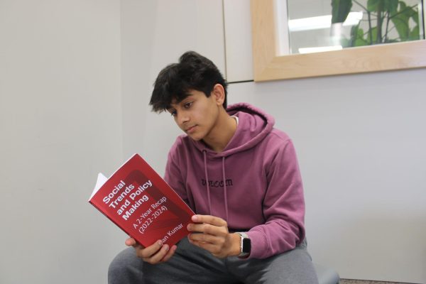 Driver of change:  Senior Ayan Kumar reads his book “Social Trends and Policy Making: A 2-Year Recap (2022-2024).” Kumar wrote the book as a compilation of his blogs relating to current events, social injustice and climate change. 