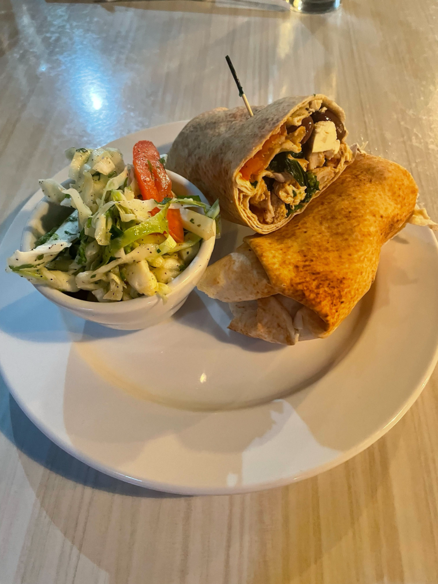 Hello, portable lunch: The Greek chicken wrap comprises sliced tomatoes, olives and chicken enveloped pita bread. With a side dish of rice, this sandwich was nothing short of tasty.
