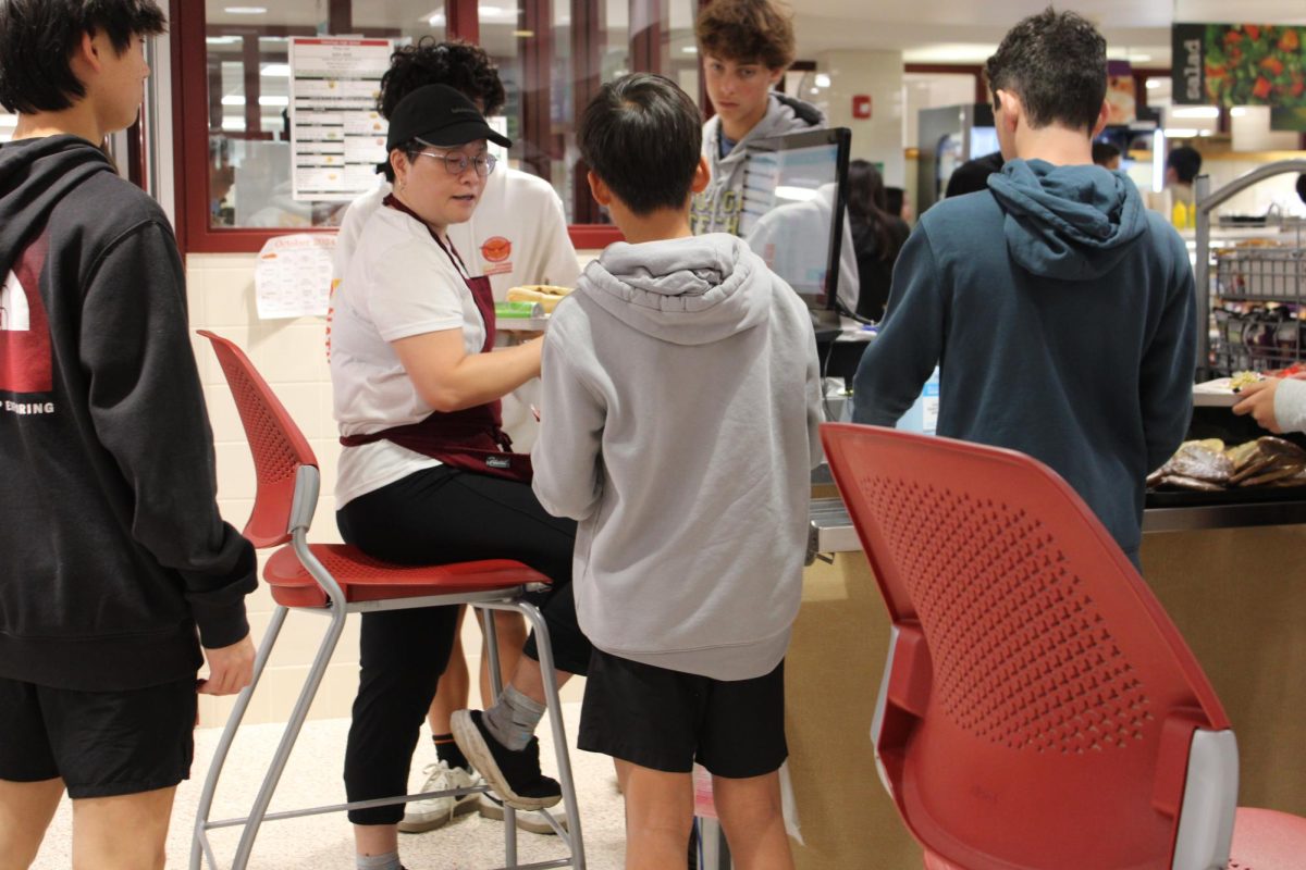 Rising costs: A cafeteria cashier helps students check out at the lunch line. TESD increased meal prices by 75 cents and a la carte items by 6% for the 2024-25 school year.
