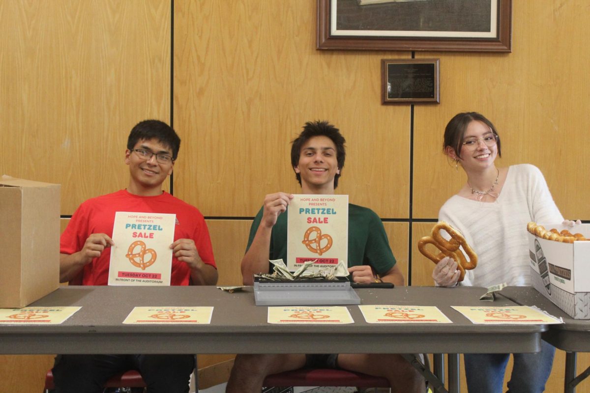 Pretzels for perseverance: Senior Joaquin Orellana Herrara, junior Avi Desouza and sophomore Sammie Lee (left to right) sell pretzels for mental health awareness club Hope and Beyond.