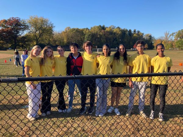 Helping out: Members of Peer Mediation pose at the HES Trunk-or-Treat event. At the event, members raised money for Hurricane Helene victims.