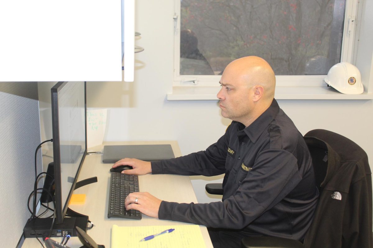 Newly appointed: Fire Administrator Joe O’Leary works in his office in the Tredyffrin Township Building. The Tredyffrin Township and Easttown Township boards of supervisors officially appointed O’Leary to the new position of Fire Administrator on Oct. 21. As Fire Administrator, O’Leary will serve as a bridge between the townships.