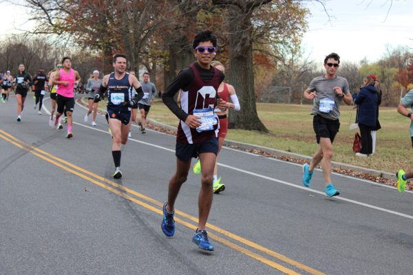 Hitting his stride: Fourteen miles into his race, junior Rowan Chetty runs in the 2024 AACR Philadelphia Marathon. Chetty finished in three hours and 11 minutes, placing 11th in his age group. He will continue to run during the winter track season.