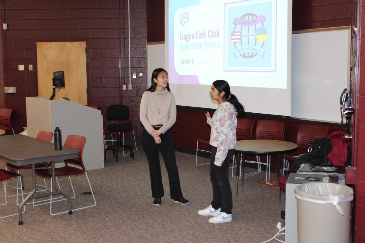 Bridging the gap: Lingua Link president Jessica Joseph (right) and vice president Angela Wang (left) hold an informational meeting. Members of Lingua Link connected with Ukrainian students to teach them English virtually.