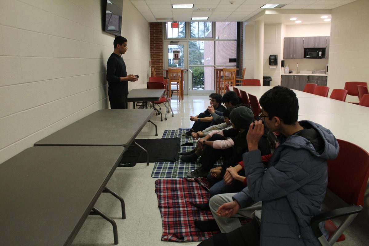 Friday Prayers: Muslim students listen to a speech before starting the prayer. Sophomores Zainab Hassan, Fudail Ahmed, and Najm Ferjani started the prayers in school so students wouldn’t have to leave school to practice their religion. 