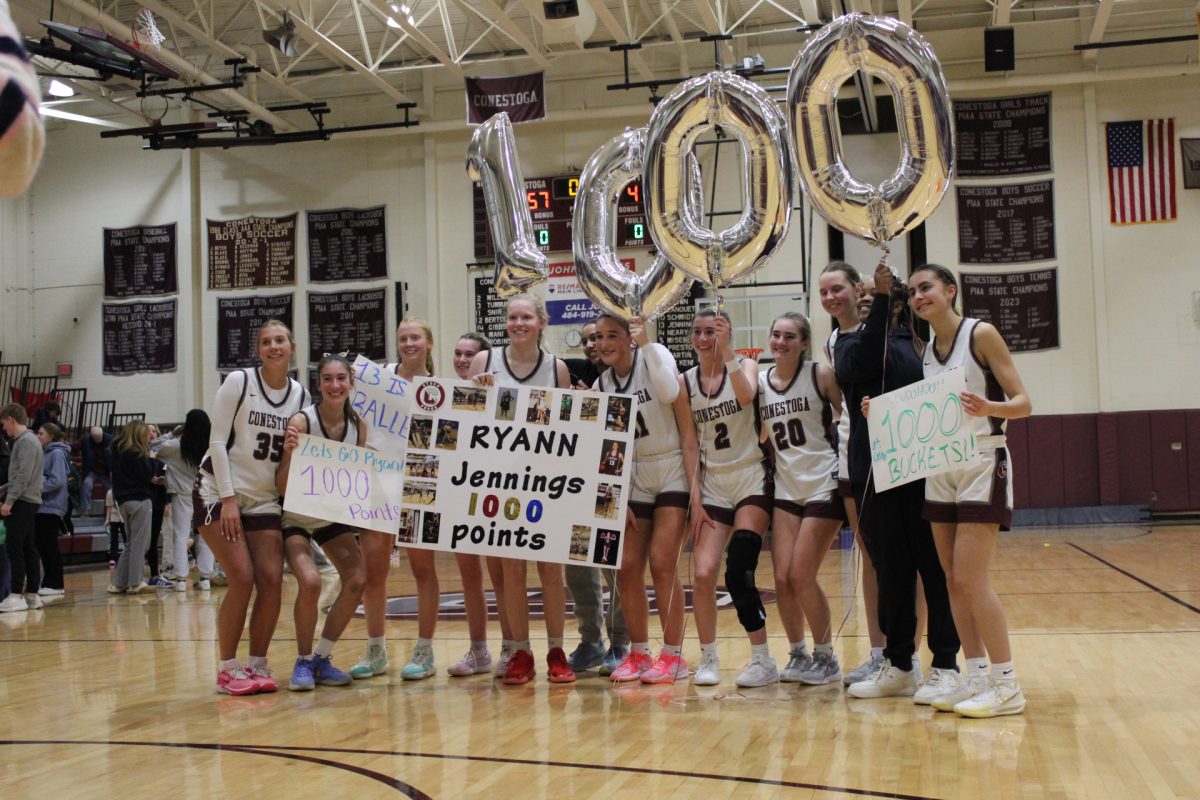 Sincere support: Junior Ryann Jennings poses for a picture, celebrating her 1,000th point. Jennings has been playing shooting  guard on Conestoga’s girls’ basketball team since her freshman year.