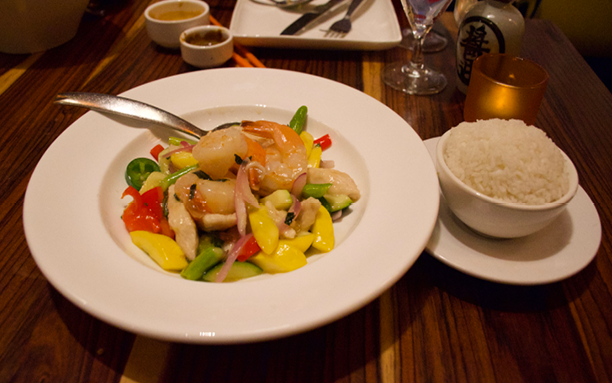 Colorful plating: The wok Amish chicken and gulf shrimp is served with lots of vegetables and a side of rice. Personally, the Vietnamese lime basil sauce was too sweet and threw off the balance of the dish.