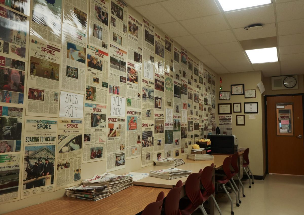 Continuing the legacy: Laminated pages of The Spoke line the walls alongside signs with the school years. The newspaper served as a local news source, beginning under the name Eastfrin Echoes, shifting to The Conestoga Spoke and later choosing The Spoke.