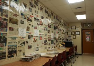 Continuing the legacy: Laminated pages of The Spoke line the walls alongside signs with the school years. The newspaper served as a local news source, beginning under the name Eastfrin Echoes, shifting to The Conestoga Spoke and later choosing The Spoke.