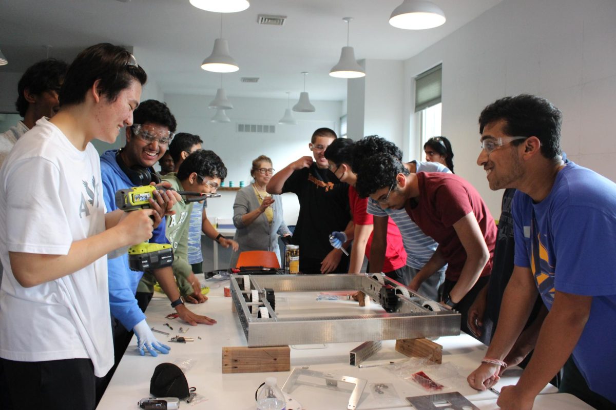 Construction in action: The community robotics team, Blast 10989, builds parts of their next robotics project. Over the summer, it held a weeklong camp for middle schoolers and rising freshmen. They hope to continue expanding their services to the community.