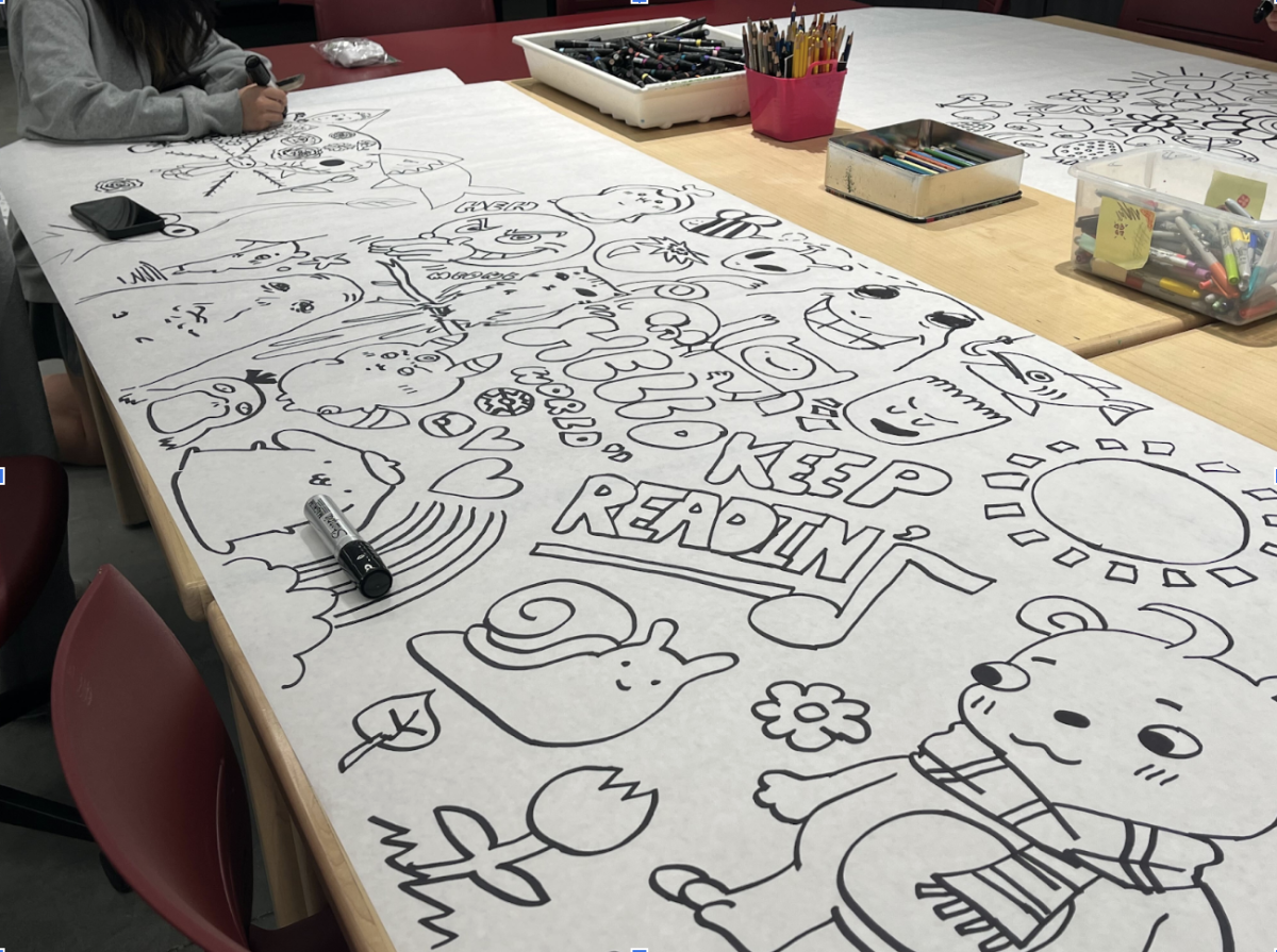Drawing decorations: A sheet of paper lies on the table filled with images drawn by studio art students. On Aug. 28, studio art teacher Amy Cruz tasked students with drawing images on the paper to be displayed around the school. In the future, Cruz hopes to make more decorations with her classes.