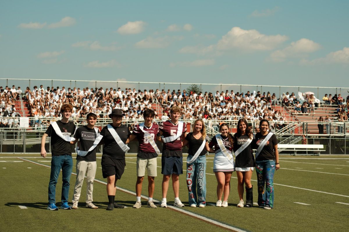 Court celebration: The Homecoming Court members pose with sashes on Teamer Field. The court was officially honored at the pep rally on Sept. 19.
