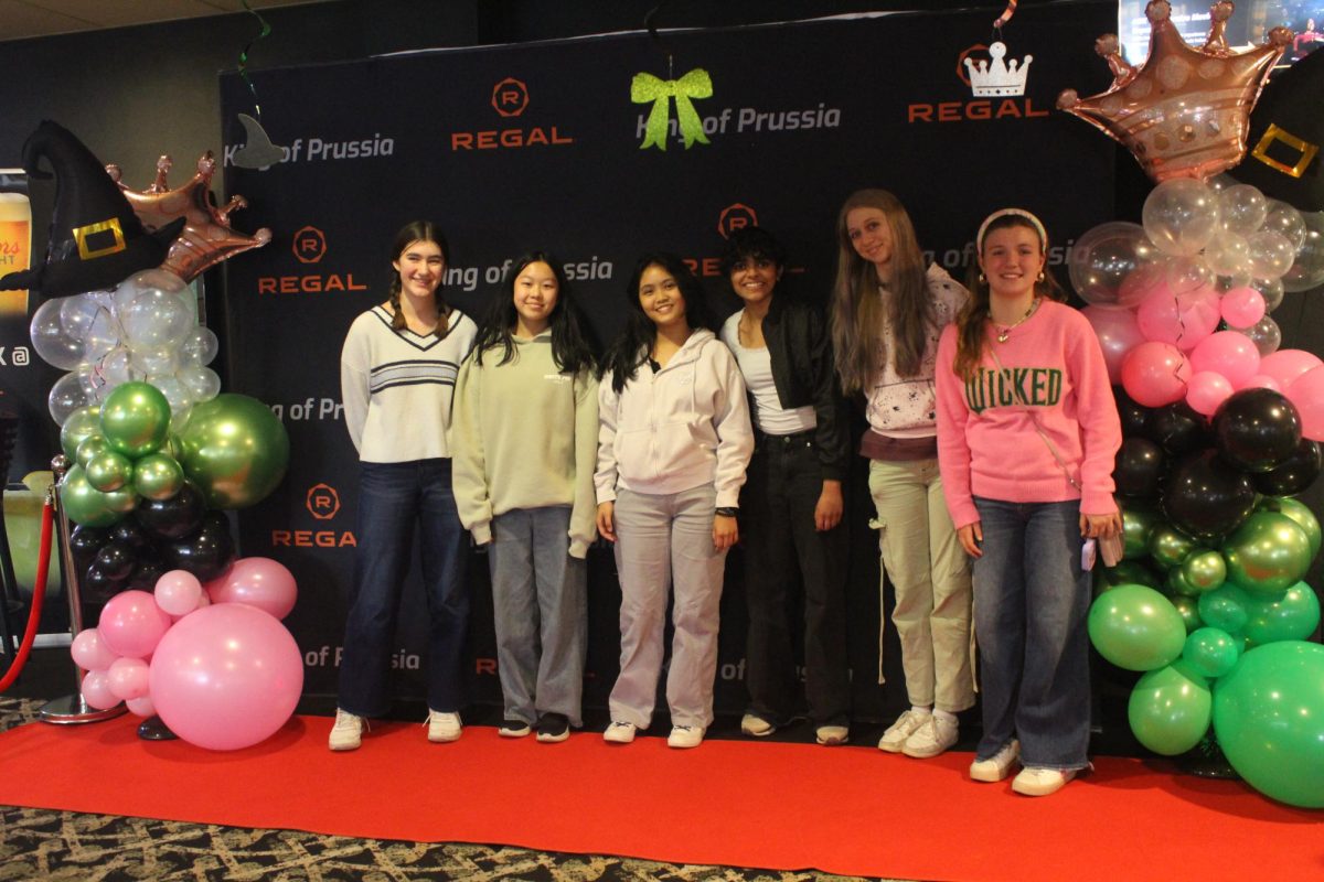 Opening to Oz: Conestoga students enter the Regal UA theatre for an early screening of “Wicked: For Good.” Teachers organized the movie experience to enhance the students’ education.