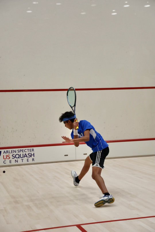 Deep in focus: Junior and squash player Neil Srivastava rallies with an opponent at the Arlen Specter Squash Center in Philadelphia. He has competed in squash for over nine years and through his hard work achieved the No. 2 ranking  in the United States. In the future, he hopes to continue to play team squash in college.