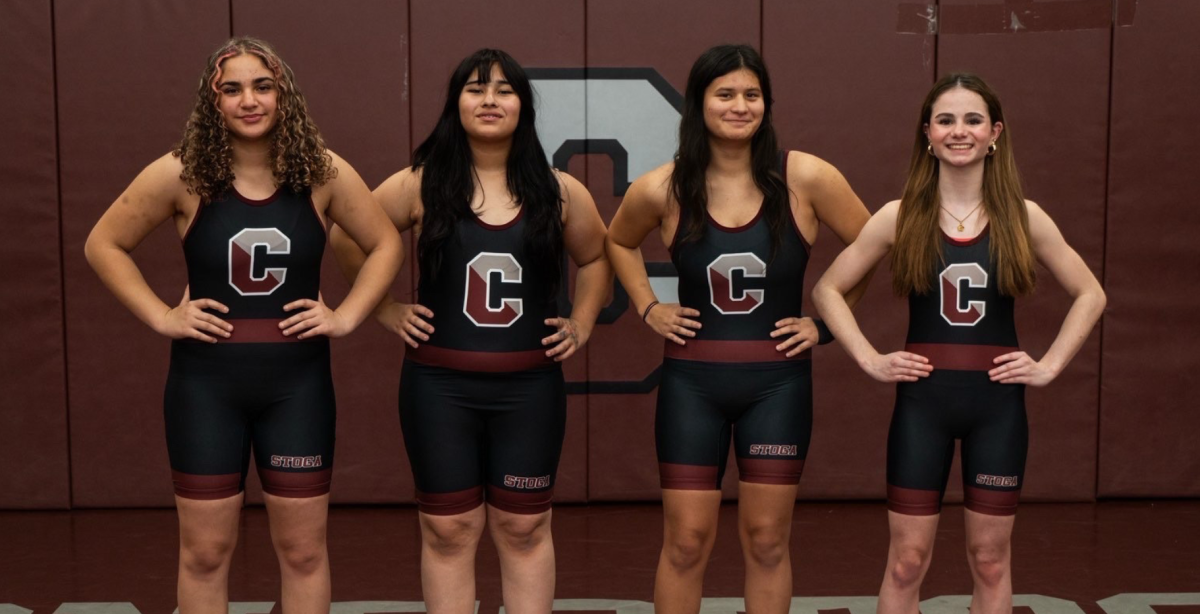 Ready to go: The female members of the Conestoga wrestling team pose for a group picture. This year, they have been working  to create a team and have been advertising by holding meetings and posting flyers. In the future, they hope to grow the team to wrestle against female wrestlers from other schools.