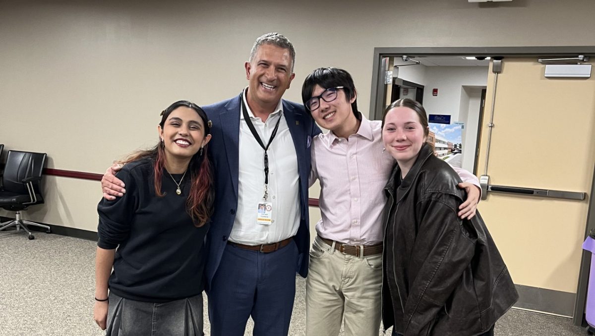 Collaboration for change: Dr. Oscar Torres stands next to members of the diversity committee. He attended his final district diversity meeting on Oct. 15. As the new Director of Equity and Public Programs, Dr. Kim Morris will expand upon his work.