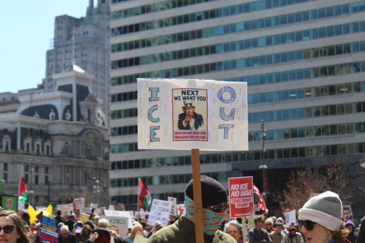 Taking a stand: A rally attendee holds up a sign on protesting ICE’s presence within Philadelphia. Participants of the March 28 “No Kings” rallies gathered on the streets of various locations nationwide to bring attention to concerns regarding current political policies.