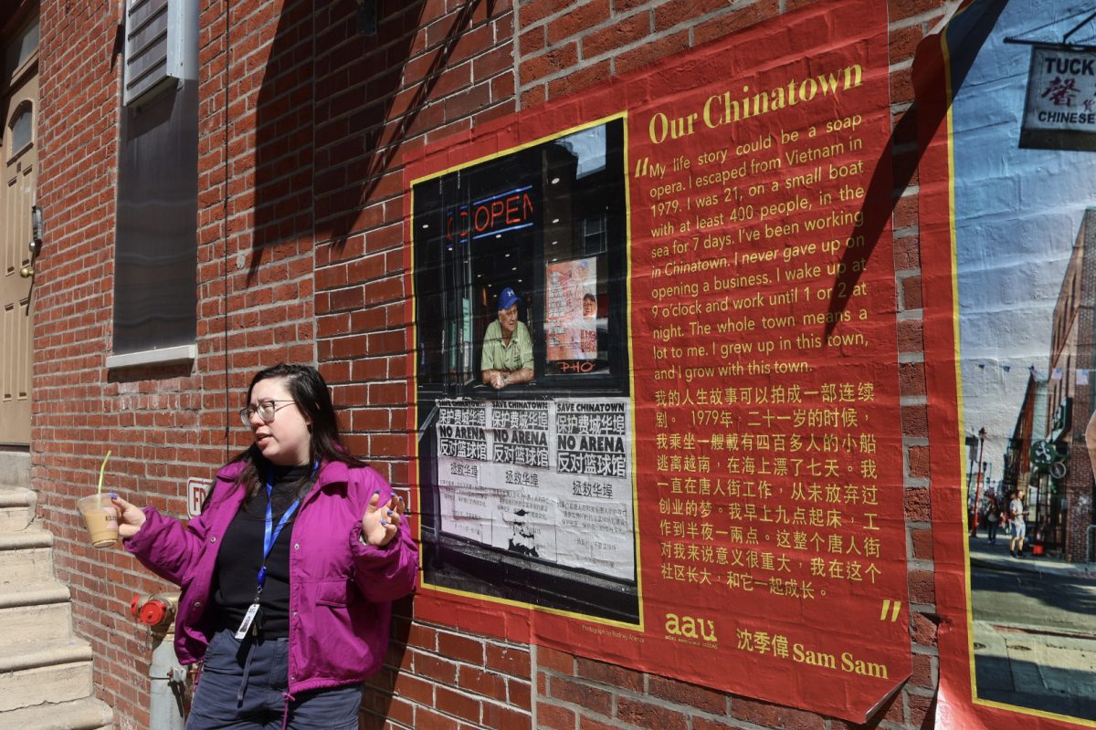 Magical memories: Tour guide Peri Law speaks on ‘Our Chinatown’, signs posted around the town featuring testimonies of long-term residents. ‘Our Chinatown’ was a project to maintain the special memories of the locals and their journeys throughout the town. Law continues as a youth coordinator at Asian Americans United (AAU), where she informs visitors of the importance of these signs. (Kimberly Wang / The Spoke)