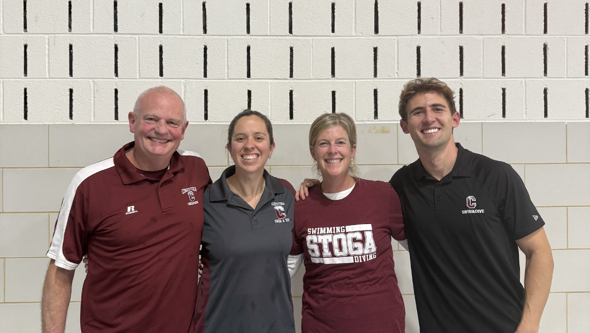 Coaching crew: Coach Rob Kirkby (left) and Leah Roberts (second from left) pose with the rest of the swim coaches. Kirkby coached the girls’ swim team for 36 years before retiring. Kirkby looks forward to seeing the team continue its success in upcoming seasons. 