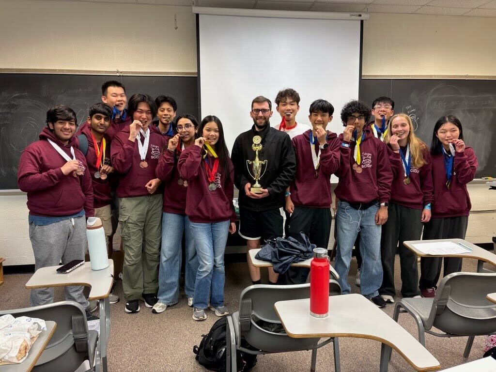 Triumphant together: Members of Conestoga’s Science Olympiad team gather together with the medals and team trophy they won at the regional Science Olympiad competition, where they placed second and qualified for the state competition. Conestoga placed ninth overall at states.